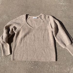 Women’s tan V-neck sweater